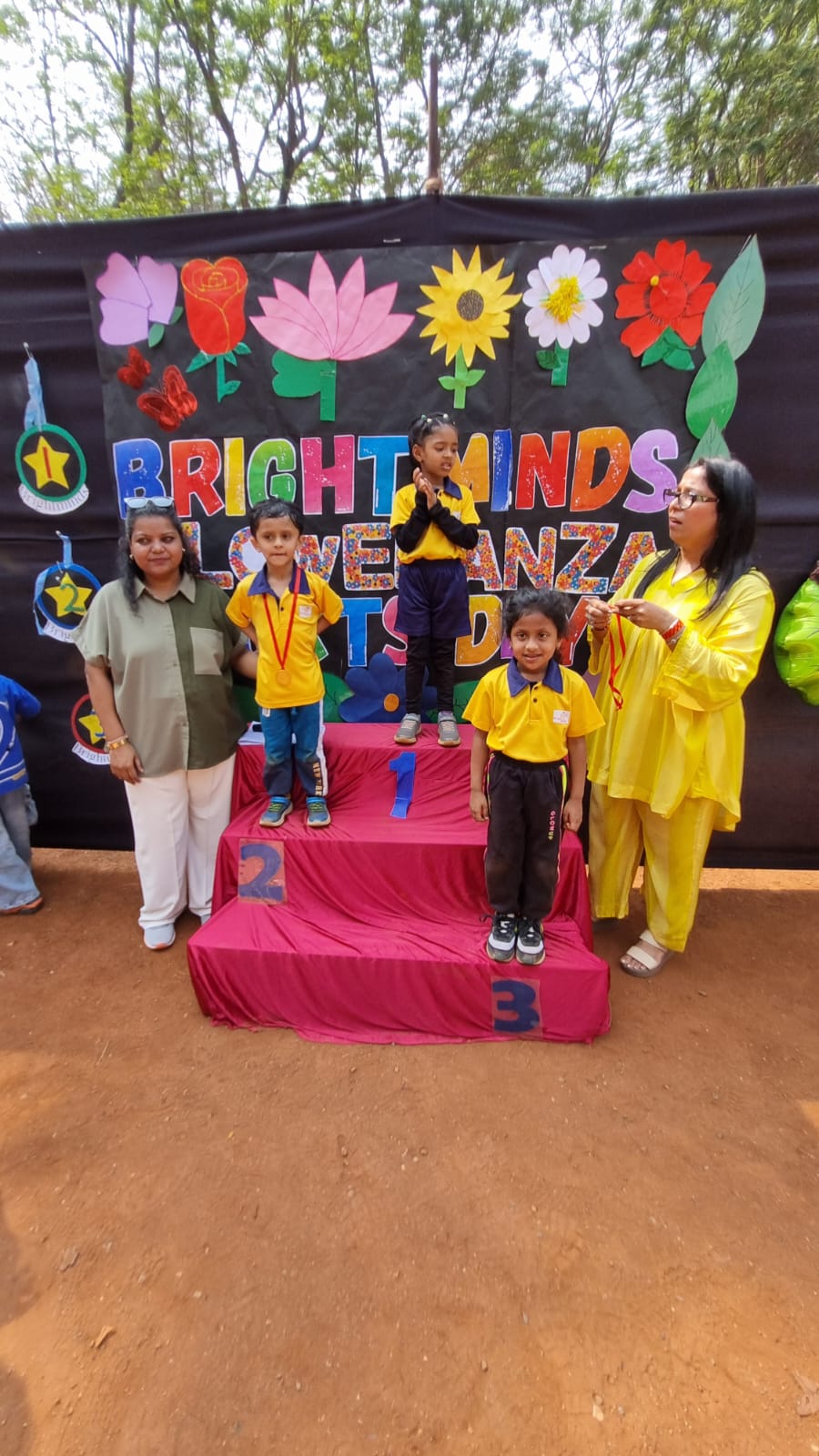 Sports day winners on the podium at Bright Minds